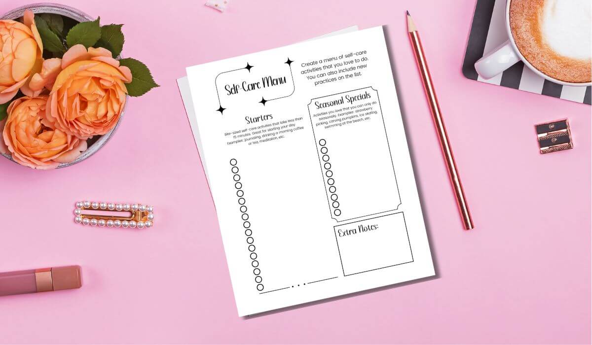 printable self-care menu template on a pink table with flowers, coffee and accessories.