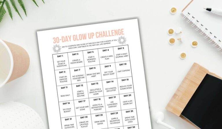 printable glow up challenge on a white desk with phone, notepad, cup and pen.