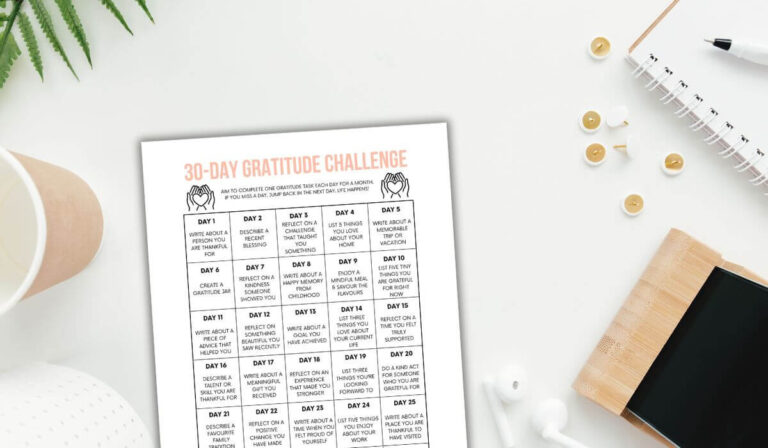 free printable 30 day gratitude challenge on desk with tree sprig.