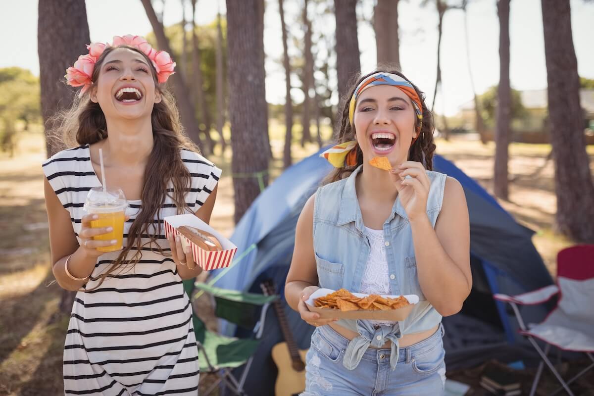 two women on a camping trip in the forest.