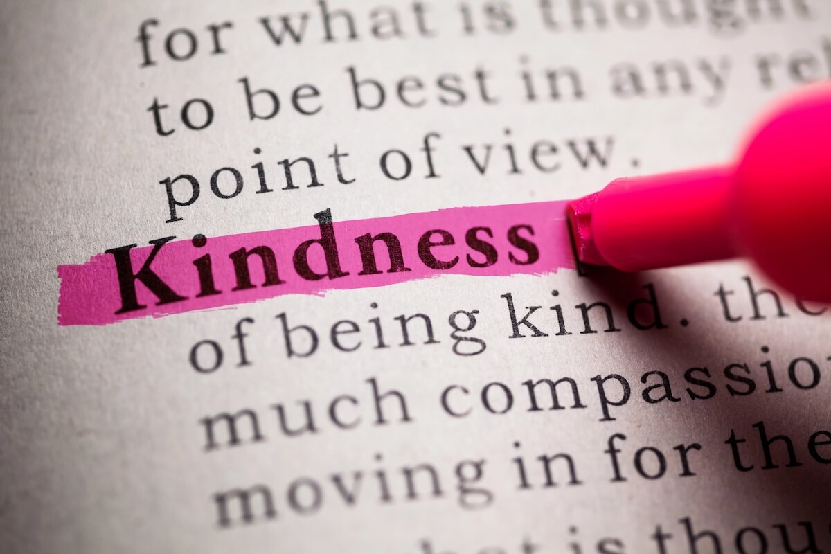 dictionary definition of kindness highlighted in pink.